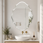 Frameless bevelled shield shaped wall mirror